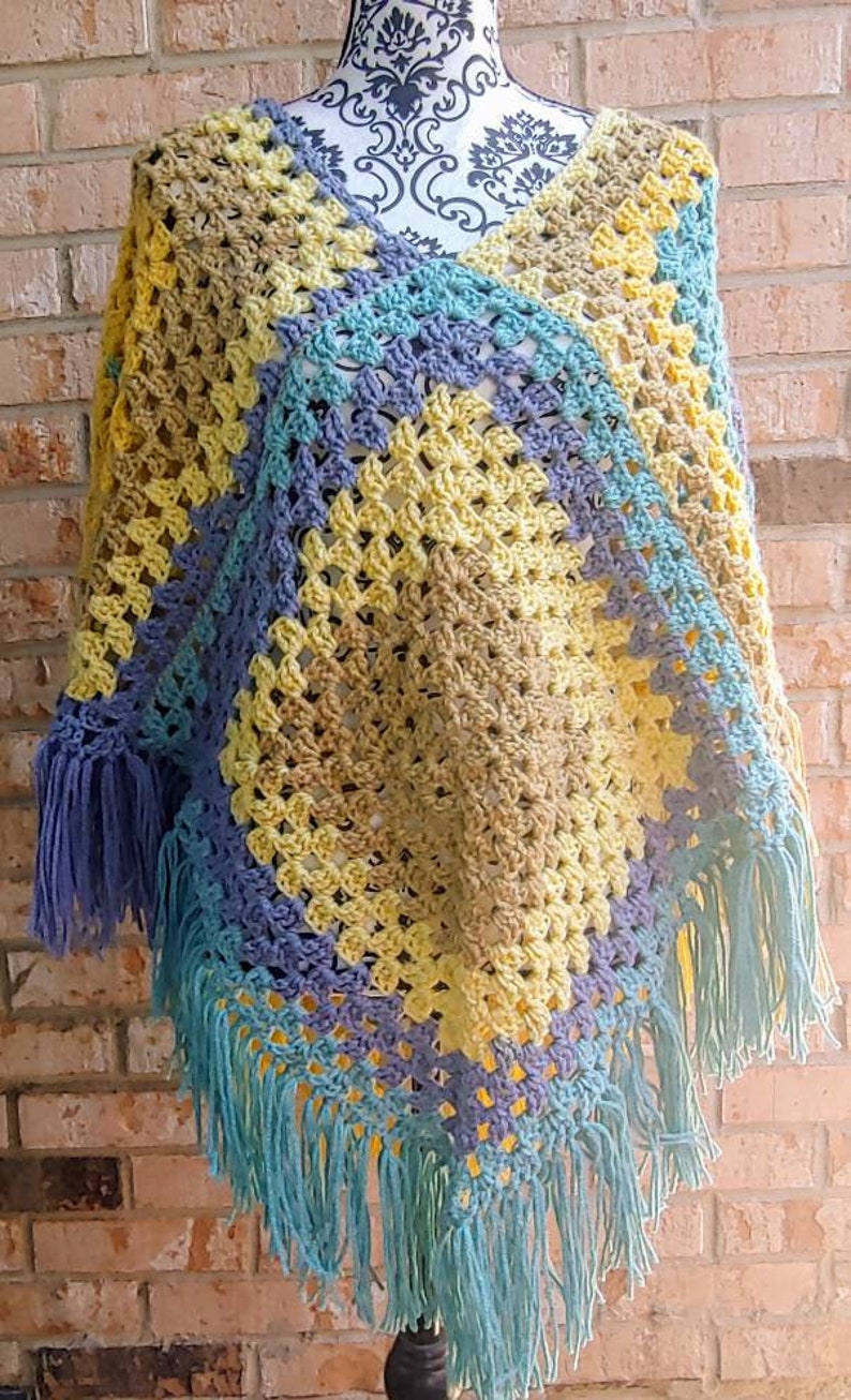 1970s themed poncho. Vintage inspired poncho Colorful crochet poncho In tones of blue and yellow