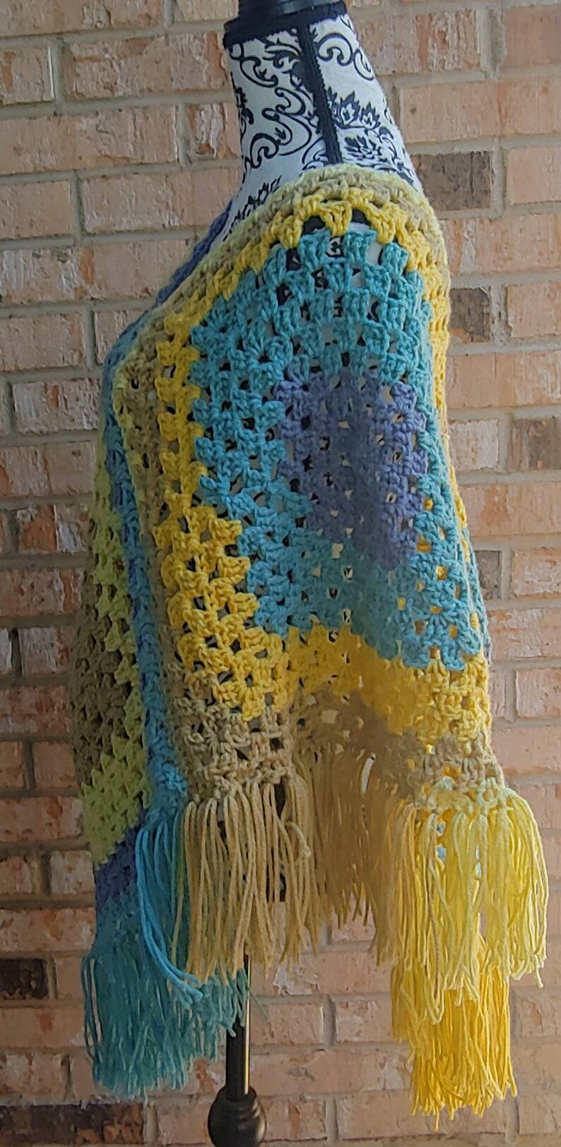 1970s themed poncho. Vintage inspired poncho Colorful crochet poncho In tones of blue and yellow