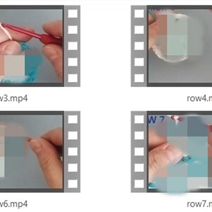 May include: Four close-up video clips showing a person crocheting with a red crochet hook. The clips are labeled "row3.mp4", "row4.mp4", "row6.mp4", and "row7.mp4".