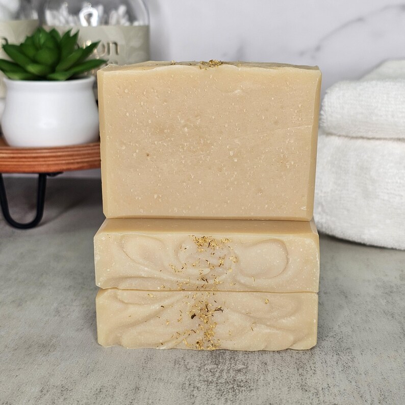 Indulge your senses with the luxurious and botanical aroma of our Chamomile Soap. Scented with Pure Chamomile essential oil and fragrance oil, this scent will transform your everyday bathing routine into a delightful, relaxing, and calming experience. Crafted with care, it leaves your skin feeling soft, smooth, and refreshed. To enjoy the full benefits of this soap, wet the soap and work it into a rich lather, wash and rinse off thoroughly.