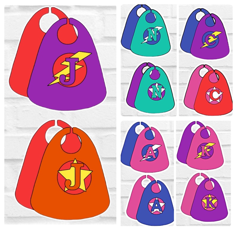 May include: Set of ten superhero capes in various colors, each with a different letter and lightning bolt design. The capes are made of felt and have a hole at the top for the head.