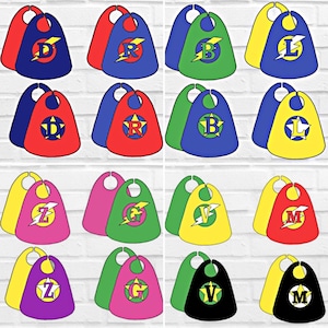 May include: Set of 10 superhero capes with different letters of the alphabet. Each cape is made of red, blue, green, pink, yellow, or black fabric with a lightning bolt and a letter printed on it.