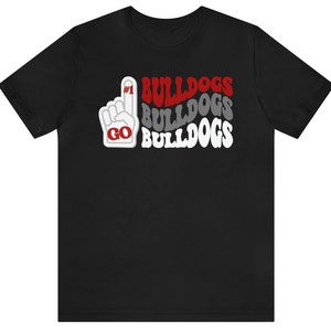 May include: Black t-shirt with a white and red graphic of a hand making a number one gesture with the text "#1 BULLDOGS BULLDOGS BULLDOGS GO"