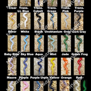 May include: A chart displaying 18 different coloured glass beads, each shaped like a squiggly line. The beads are arranged in a grid of 6 rows and 3 columns. The colours include clear, light blue, cobalt, green, pink, purple, silver, white, black, unobtainium, grey, dark grey, baby blue, sky blue, aqua, mint, jade, green frog, mauve, purple, purple urple, yellow, orange, red, baby pink, pink, steel blue, lapis, purple rain, and glow glass.
