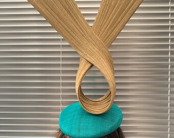 Jade Green beret perching hat adorned with a dramatic Gold twisting sculpture.