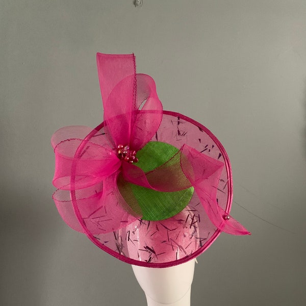 Hotpink and Lime perching pod hat adorned with a dramatic halo with sculptured bow detail.