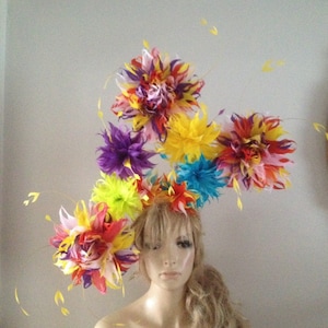 Multi coloured fascinator headpiece of yellow turquoise red orange black purple pink hand cut feather flowers.