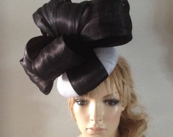 Pale Silver perching beret hat adorned with luxurious sculptured black silk abaca bows.