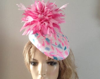 ivory,pink & blue silk abaca perching hat adorned with a magnificent hand cut pink feather flower