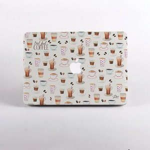 May include: A white laptop skin with a coffee cup pattern and the text "But first... coffee".