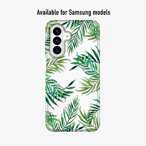 May include: Clear phone case with a green watercolor palm leaf pattern. The case is designed for Samsung models. The text "Available for Samsung models" is printed at the top of the case.