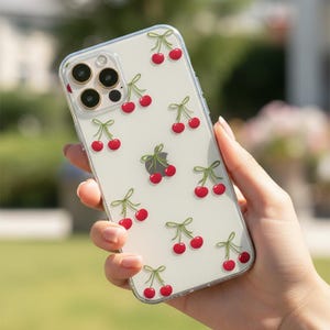 Coque de portable transparente Cherry Bows pour iPhone 17, 16e, 15, 14, 13, 12, Samsung S26, S25 et Google Pixel. Compatible MagSafe