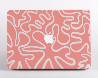 May include: A laptop skin featuring a coral pink background with a repeating pattern of white, irregular, wavy, organic lines. The center of the skin displays a cutout for the white Apple logo, which is clearly visible against the pink surface.