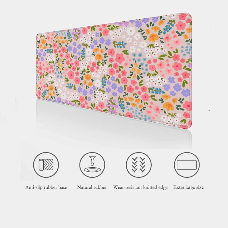 May include: A pink floral mouse pad with a white, pink, and yellow floral pattern. The mouse pad has a non-slip rubber base, natural rubber, and a wear-resistant knitted edge.