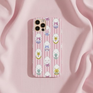 May include: A rectangular phone case featuring a repeating pattern of various illustrated cats in white scalloped frames against a background of vertical light pink and white stripes. The case has a cutout for a triple camera lens system.