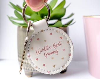 La mejor abuela del mundo - Llavero blanco de piel sintética. Regalo para el Día de la Madre. Regalo de cumpleaños.