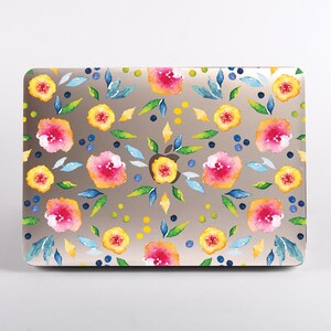 May include: A laptop hard shell case featuring a watercolour floral pattern with pink, yellow, and orange flowers, green and blue leaves, and small dark blue dots. The design is arranged symmetrically around a central cutout for an Apple logo.