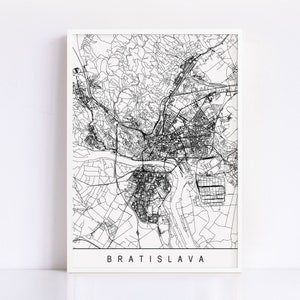 May include: Black and white line art map of Bratislava, Slovakia. The map shows the city's streets, rivers, and other features. The word "BRATISLAVA" is printed in all caps at the bottom of the map.