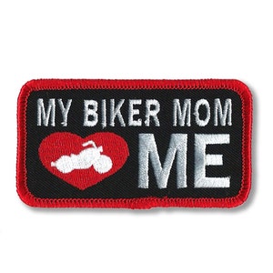 May include: Black embroidered patch with red stitching. The patch features a white motorcycle inside a red heart with the text "MY BIKER MOM" and "ME" in white.