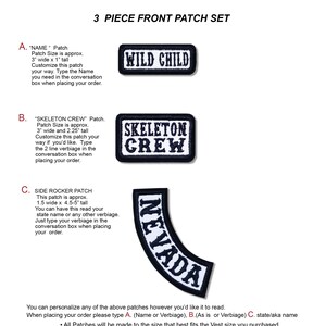 May include: A set of three embroidered patches. The first patch reads "WILD CHILD" in white on a black rectangle. The second patch says "SKELETON CREW" in white on a black rectangle. The third patch is a curved patch that says "NEVADA" in white on a black background.