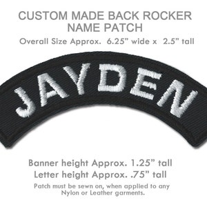 May include: Black and white custom made back rocker name patch with the name "JAYDEN" embroidered in white on a black background. The patch is 6.25 inches wide and 2.5 inches tall. The banner height is 1.25 inches and the letter height is 0.75 inches.
