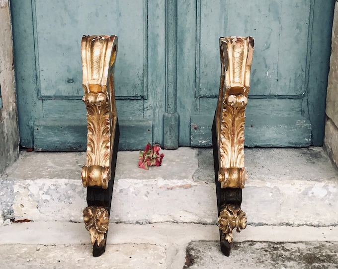 A stunning pair of antique French gilt wood, hand carved curtain pole brackets of very large decorative proportions