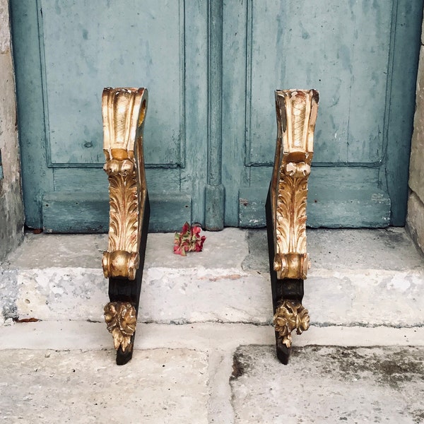 A stunning pair of antique French gilt wood, hand carved curtain pole brackets of very large decorative proportions