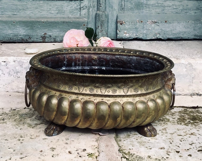 A superb 18th century antique French repousse jardiniere with lions head & claw feet, brass handmade planter- wine cooler