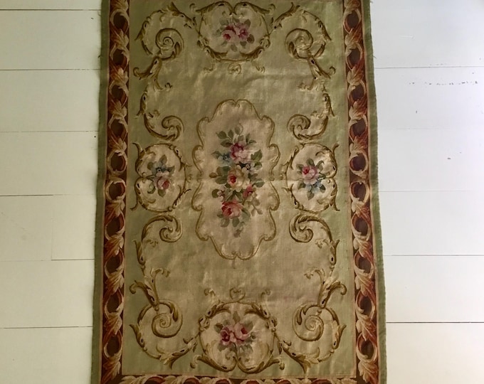 A fabulous antique French Aubusson rug or wall hanging of great proportions depicting French roses within central medallion