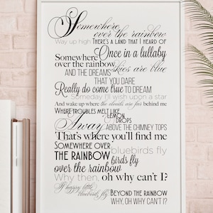May include: Black and white typography print with lyrics from the song "Somewhere Over the Rainbow". The lyrics include the phrases "Way up high", "Once in a lullaby", "Really do come true", "Where troubles melt like lemon drops", "That's where you'll find me", "Somewhere over the rainbow", "Why then, oh why can't I?" and "Beyond the rainbow".