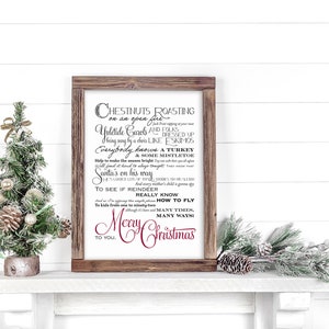 May include: A framed print with a white background and black text. The text reads "Chestnuts roasting on an open fire... Yuletide carols and four... Everybody knows a turkey... Santa's on his way... To see if reindeer really know how to fly... Merry Christmas to you".