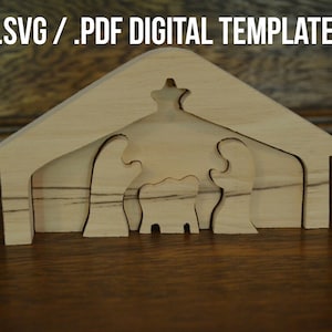 May include: A wooden nativity scene cutout with a star on top of the roof. The scene includes the figures of Mary, Joseph, and baby Jesus. The figures are cut out of wood and are layered on top of each other. The scene is made of light brown wood and is sitting on a wooden surface.