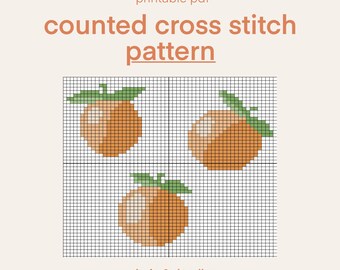 Könnte beinhalten: Ein druckbares PDF-Zählkreuzstichmuster mit drei orangefarbenen Früchten mit grünen Blättern. Der Text "printable pdf" und "counted cross stitch pattern" ist in einem warmen Braunton gehalten. Der Text "bujo & doodles" steht unten.