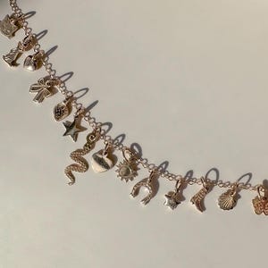 Solid 14k Gold Tiny Charms: Cat, Butterfly, Key, Heart, Snake, Star, Sun, Boot, Dog, Bow, Shell, Strawberry, Horseshoe by Honeycat