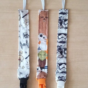 Ciucciuccio per bambini con clip ispirato a Star Wars. Venduti separatamente o in set.
