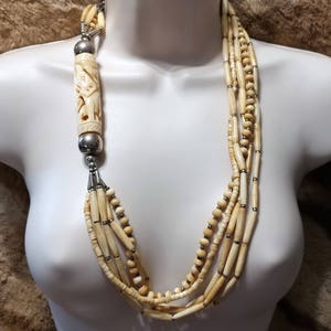 5 Strand Carved Polished Horn and Silver Tone Necklace