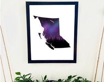 May include: A black framed print of the outline of British Columbia with a purple and blue galaxy design inside. The galaxy design includes a shooting star.