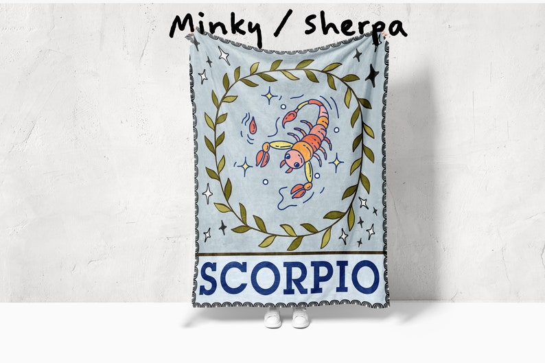 May include: A blue and green minky/sherpa throw blanket with a scorpion illustration and the word "SCORPIO" in a blue banner.