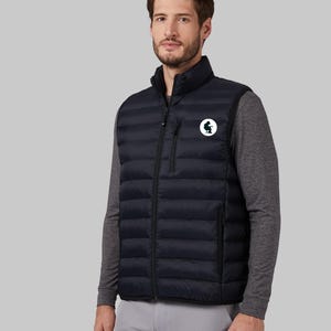 May include: A black puffer vest with a zipper closure and a small logo on the left chest. The vest has a quilted design and is worn over a gray long-sleeve shirt.