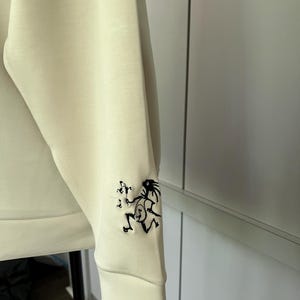 Widespread Panic Inspired - Women&#39;s Cream Colored Sweatshirt with Note Eater on the Sleeve. Free Shipping
