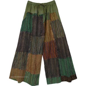 May include: Patchwork trousers with a drawstring waist in shades of green, brown, and orange. The trousers have a relaxed fit and a wide leg.