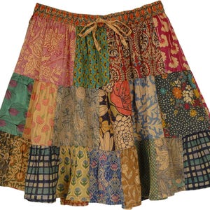 May include: A multi-colored patchwork skirt with a floral print. The skirt has a drawstring waist and a tiered design.