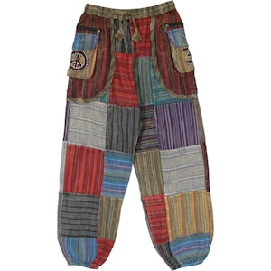 May include: Patchwork pants with a drawstring waist and multiple colors. The pants feature a variety of fabric patches in red, blue, gray, and yellow. The pants have two pockets, one with a peace sign.