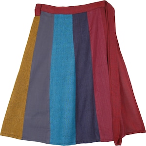May include: A colorful wrap skirt with a mustard yellow, gray, teal blue, dark blue, and burgundy striped pattern. The skirt has a wrap closure and a long tie.