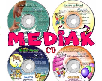 May include: Four circular music CDs labeled "MEDIAK CD" in large pink text. The discs feature colorful illustrations, song titles, and personalized names including Ashley, Michael, Samantha, and Christopher, with various themes like birthdays and nursery rhymes.