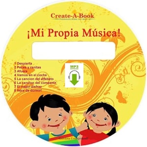 May include: A yellow and orange circular CD with the text "Create-A-Book" and "¡Mi Propia Música!" in Spanish. The CD features a cartoon illustration of two children smiling and an MP3 download icon. The text "Despierta", "Peces y ranitas", "Afuera", "Vamos en el coche", "La cancion del alfabeto", "La cancion del compartir", "El mejor disfraz", and "Hora de dormir!" is listed on the CD.