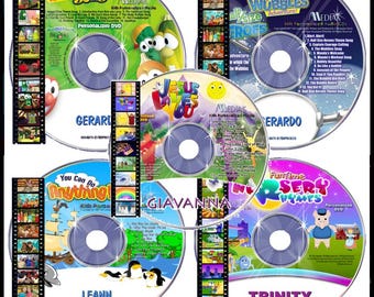 May include: A collection of personalized children's DVDs and CDs. The discs feature colorful graphics and text, including titles like "Silly Songs," "Wubbles Adventure," and "Funtime Nursery Rhymes." Names like "Gerardo," "Leann," and "Trinity" are also visible.