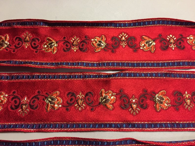 Made in France 2 inch wide Brocade Ribbon with a Navy Blue Metallic Gold Floral Pattern against a Red background Brown