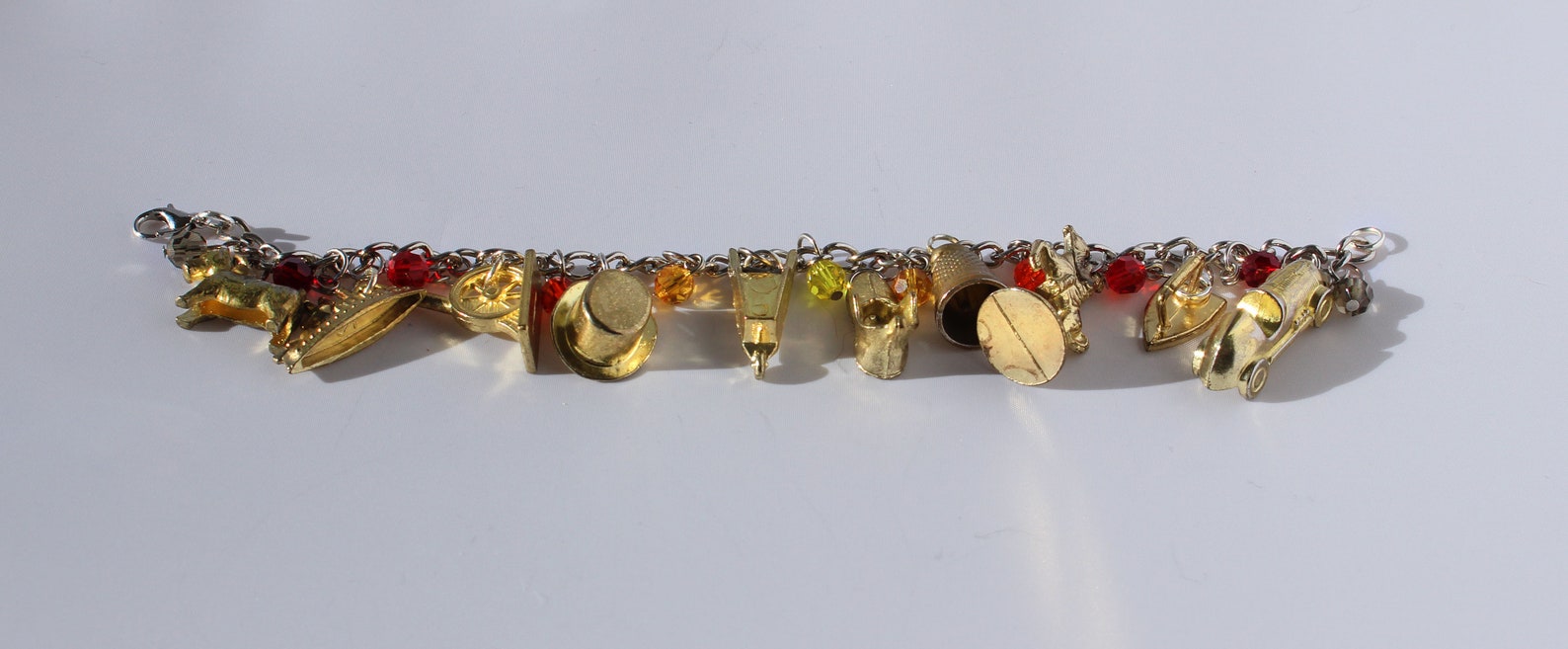 Gold Monopoly Token Charm Bracelet With Fiery Glass Beads Etsy