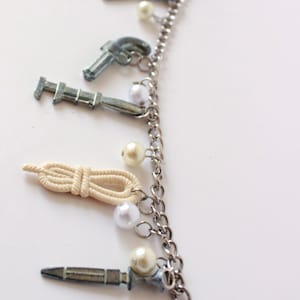 Clue Token-bedelarmband met parelkralen